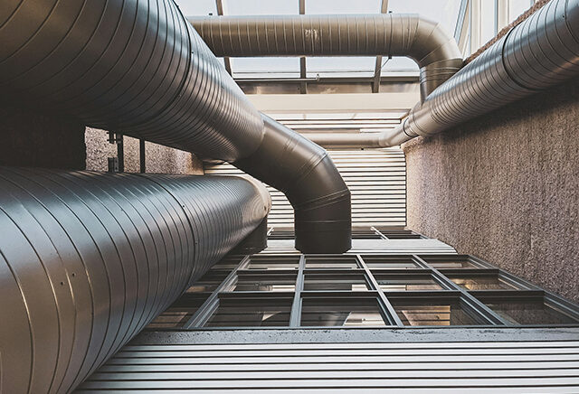 Air ducts outside the building; supporting visual for the blog post about how air duct cleaning can boost your home's value.